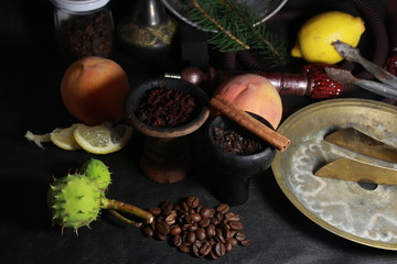 bowl with tobacco for hookah. fruits on a dark background. smoking sheesha