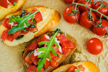 Bruschetta with cheese and tomato. Close-up
