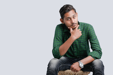 young indian college student showing direction