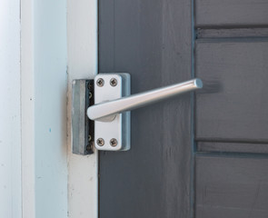 Close up view of aluminum door window handle
