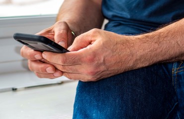 male hands  using  cell  mobile phone 