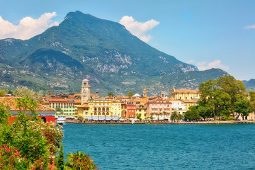 RIVA DEL GARDA, ITALY - July 17th, 2019: View to the central part of the town of Riva del Garda on Lake Garda in Nothern Italy - obrazy, fototapety, plakaty