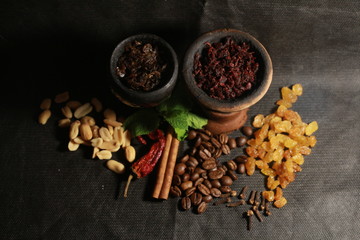 bowl with tobacco for hookah. fruits on a black background