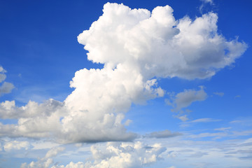 Naklejka na ściany i meble Blue sky background with puffy clouds.