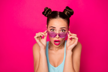 Closeup photo of pretty lady eyes full of fear wear sun specs blue tank-top isolated pink background