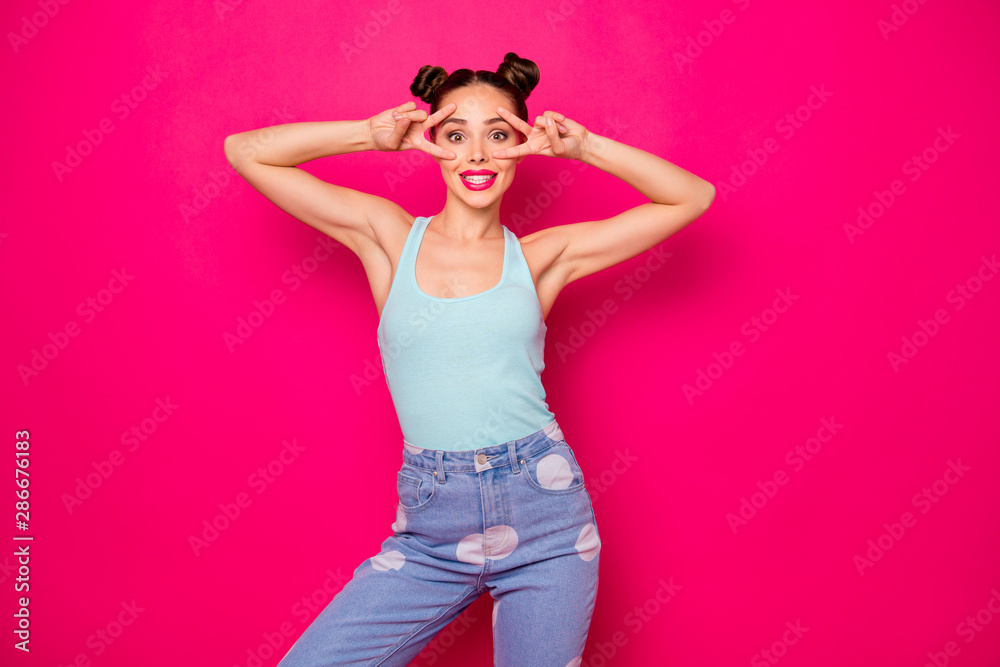 Poster Portrait of lovely cute teenager making v-signs wearing blue singlet isolated over fuchsia background