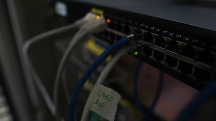 Computer engineers are repairing a network hub switch footage slow motion