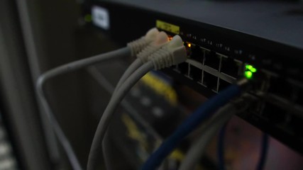 Ethernet switch. Close up. With cables, used and opened ports. Sending and receiving data over the Ethernet in a company