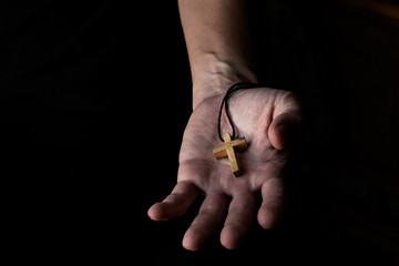 Man Giving Simple Wood Cross Sign. Concept of Evangelism Jesus Christ to the Others.