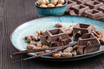 Close up choco beans, vanila stick and chocolate