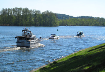 Gosen canal near Berlin, Germany sport boats driving on the canal direction Seddinsee