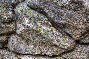 Stone texture with moss on the surface 