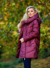 Girl fashionable blonde walk in autumn park. Jackets everyone should have. Best puffer coat to buy....