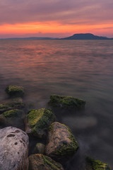 Sunset at Balaton Lake with sleeping vulcanos in the background