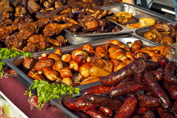 Different types of fried meat on the table. BBQ at the festival.