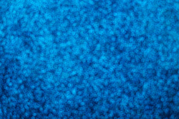 Abstract blue background. Shiny glitter bokeh.
