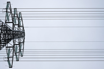 High voltage power line. View from the bottom up. Industrial infrasrtucture detail