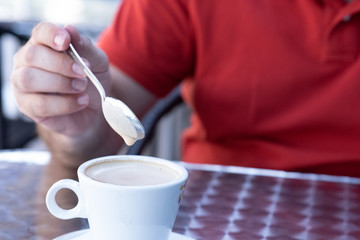 Obraz na płótnie Canvas Closeup image of a businessman`s hands with coffee