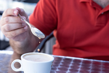 Fototapeta na wymiar Closeup image of a businessman`s hands with coffee