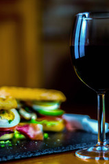 Red wine in a wine glass, celebration of a moment with a glass of wine, exquisite liquor for gourmets