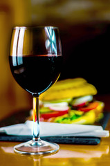 Red wine in a wine glass, celebration of a moment with a glass of wine, exquisite liquor for gourmets