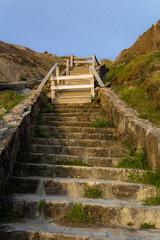 Fototapeta na wymiar wooden and stone stairs on Barrika beach in Biscay