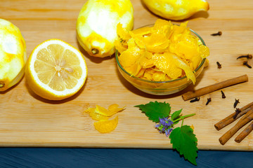 Lemons without zest on a dark wooden background.