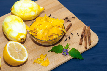 Lemons without zest on a dark wooden background.