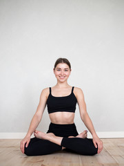 Fototapeta premium Attractive flexible girl doing yoga exercises