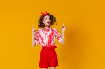 beautiful funny girl on colored yellow background