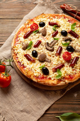 Tasty pizza with sausage and mushrooms