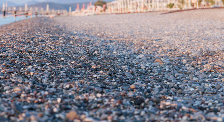 Pebble beach in the early morning light. Close-up. Turkey.