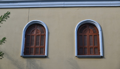 Fototapeta na wymiar Wooden windows of an old building