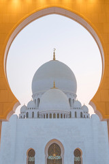 Fototapeta na wymiar Looking at main dome of Sheikh Zayed Grand Mosque Abu Dhabi at sunset blue hour