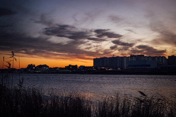 Sunset over the city and lake