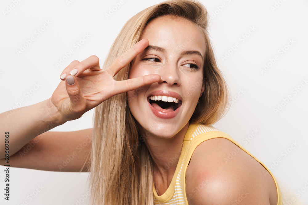 Sticker Happy smiling optimistic young pretty woman wearing hat posing isolated over white wall background.