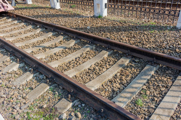 Old rusty railroad rails transport line.