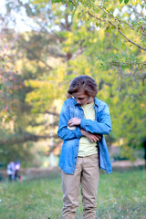 boy stroking a little hamster in his arms