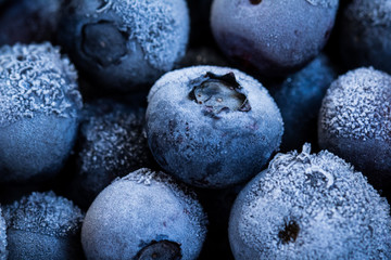 Frozen blueberries as background.  Healthy organic fruit. Natural antioxidant. Close up.