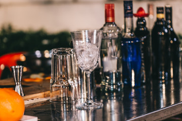 Set of cocktails on the bar counter. Night club, evening party. Lights bokeh on 