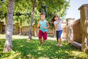 Kids running in the park, outdoors, playing games. International Children s Day