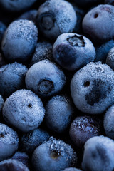 Frozen blueberries background. Healthy organic food. Close up.