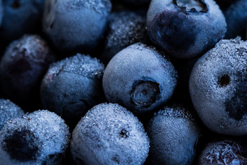 Frozen blueberries background. Healthy organic food. Close up.