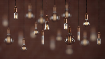 Decorative vintage light bulbs in edison style on brick wall background. 3D rendering.