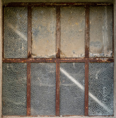 old rusty window with iron frame 