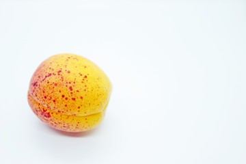 Delicious juicy apricots are located on a white background