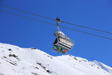 Fototapeta na wymiar Skiers in the ski lift