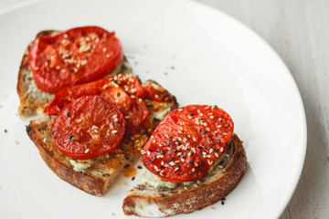 Tasty and healthy.Sandwich with cream cheese and tomatoes for Breakfast.