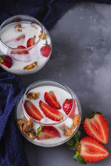 Strawberry in yogurt with muesli in a bowl. Tasty breakfast. Healthy food.