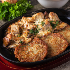 Potato pancakes with meat and sour cream. Machanka.